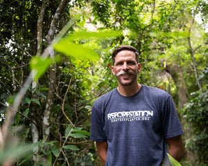Team member wearing Reforestation T-shirt 