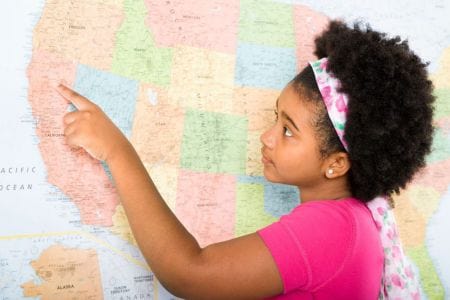 girl pointing at map