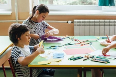 kids drawing at table