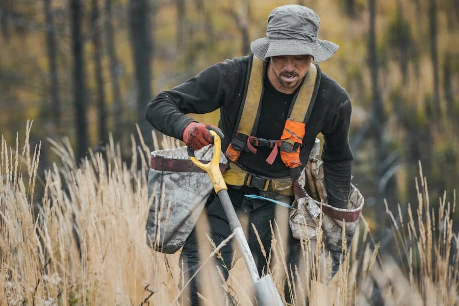 Male Tree Planter Planting Trees In British Columbia Reforestation