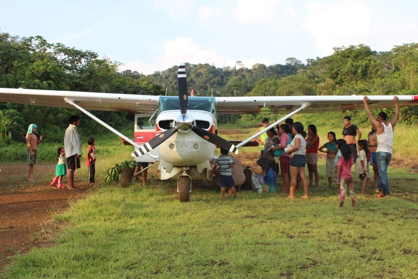 sapara women next to helicopter