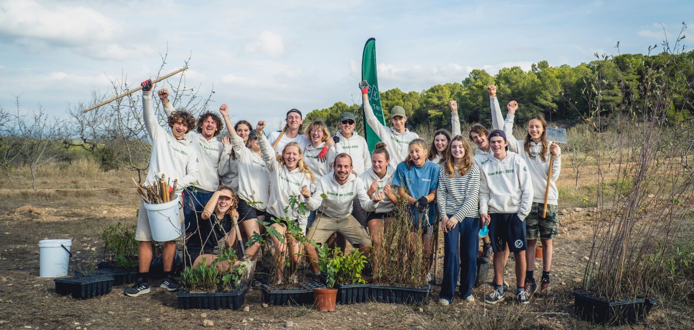 people cheering at community tree planting