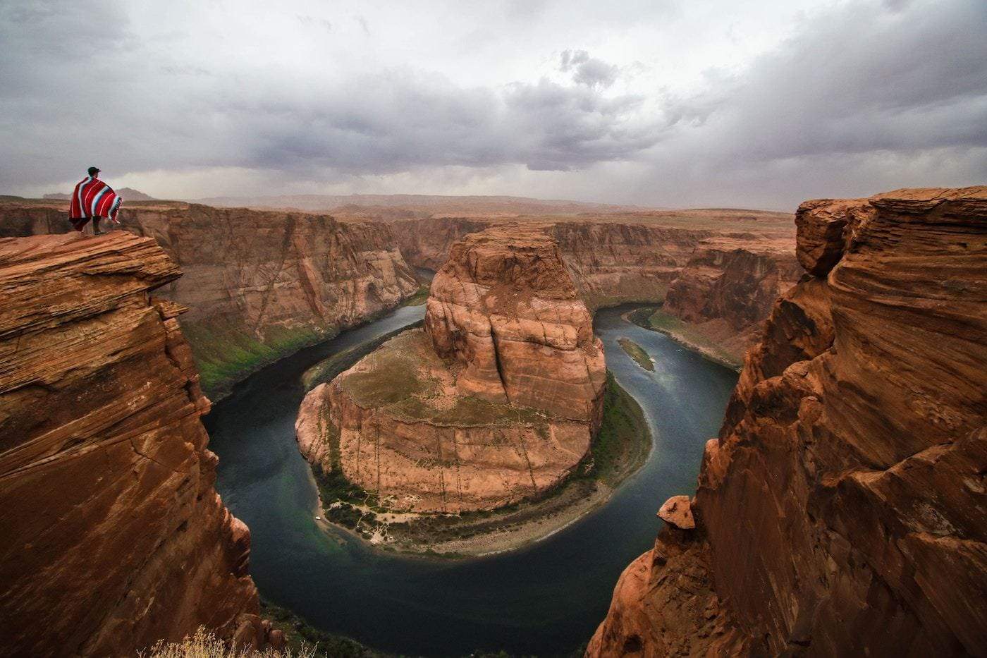Person looking out at Horseshoe Bend in Grand Canyon, landscape