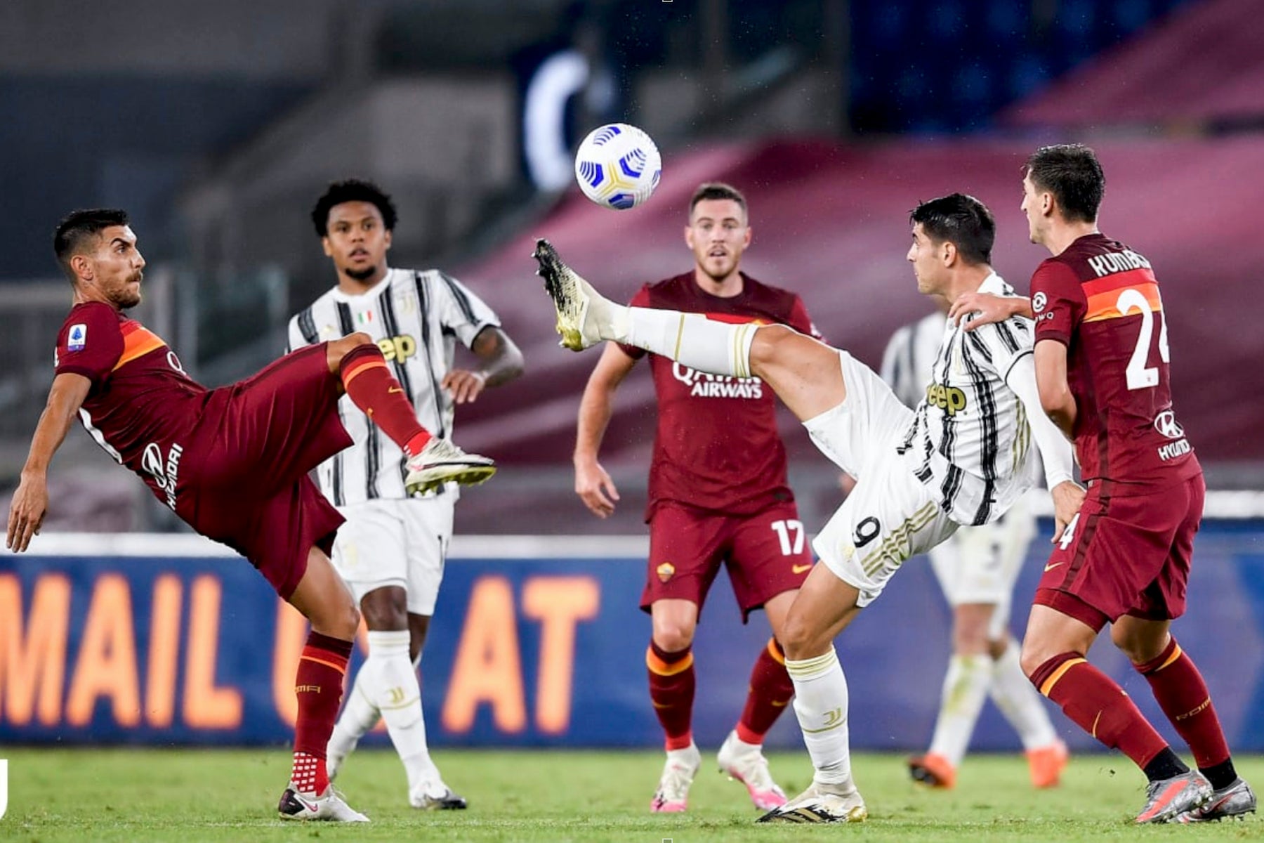 juventus game football players battling for ball red and white uniforms